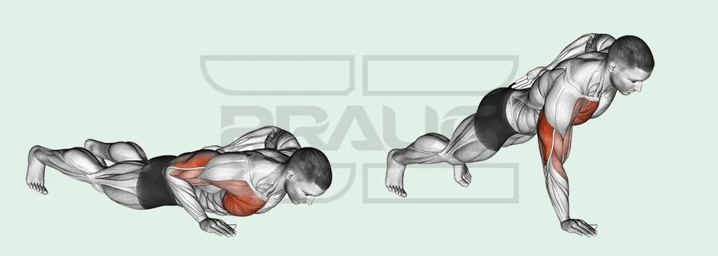 Pratiquant en pompe à une main, pieds écartés, l’autre bras dans le dos.